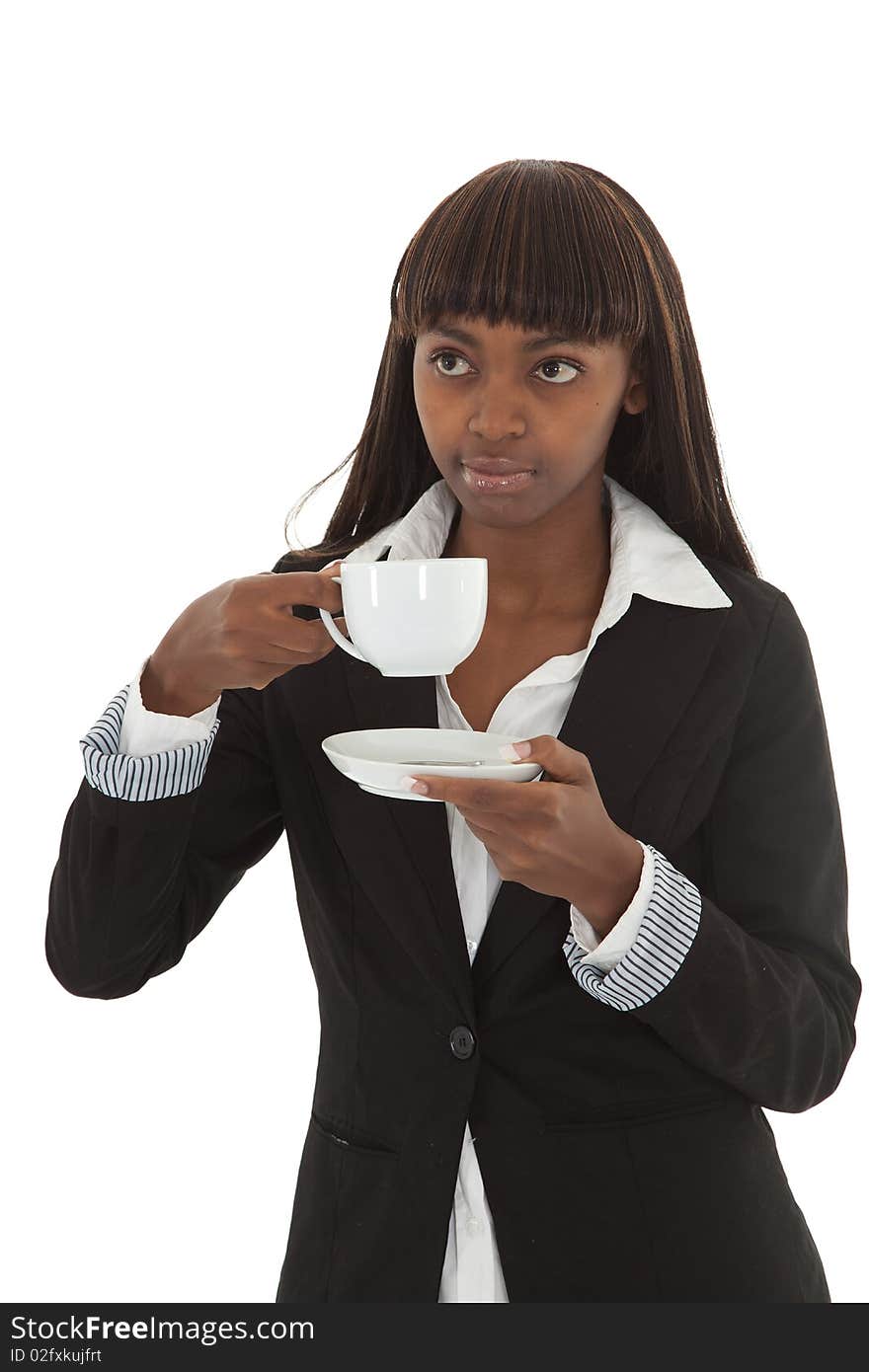 Young black female executive drinking coffee out of a cup. Young black female executive drinking coffee out of a cup