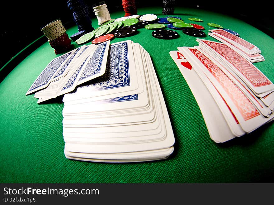 Casino gambling chips on green table. Casino gambling chips on green table