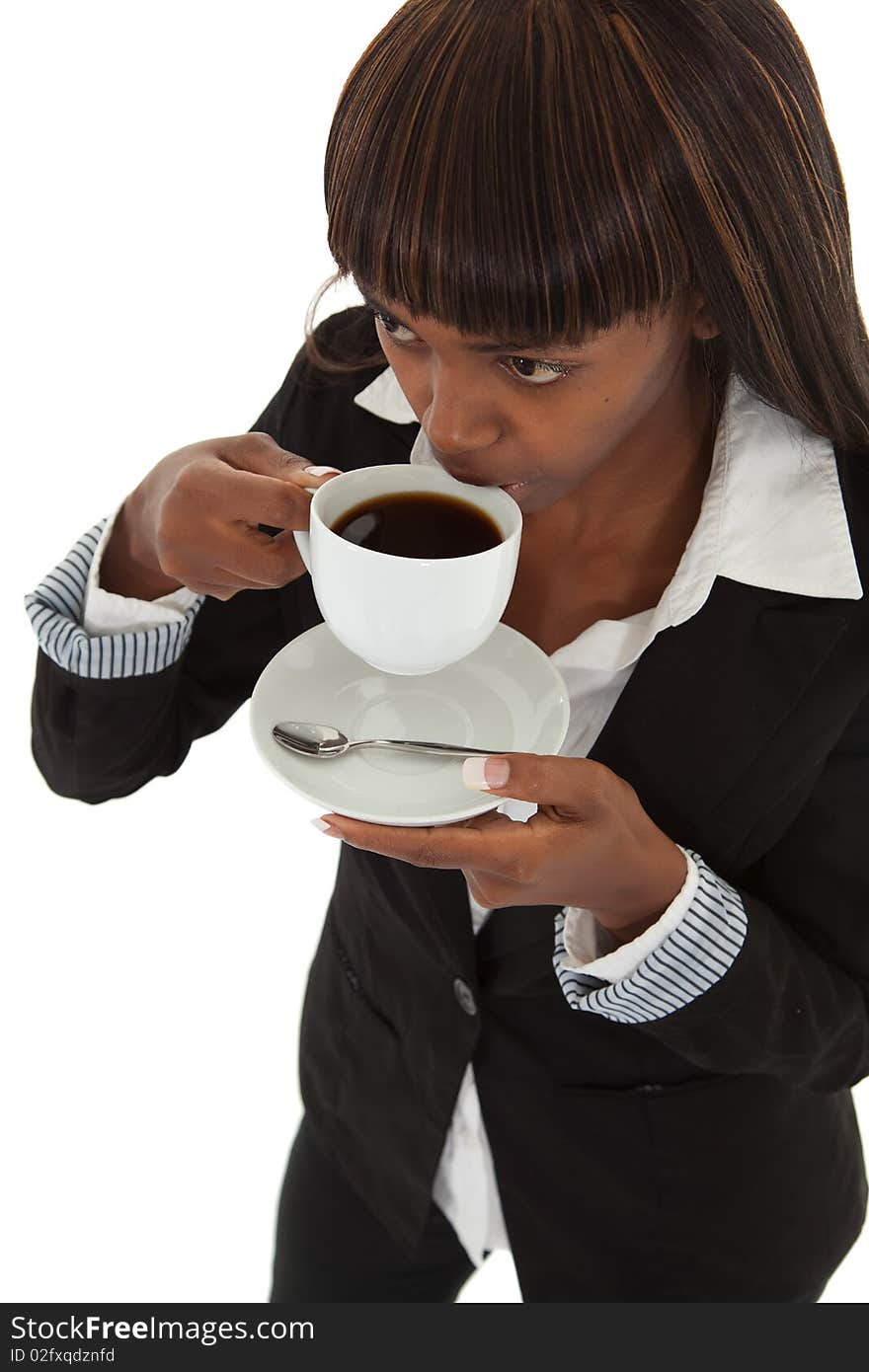 Young black female executive taking a break drinking coffee. Young black female executive taking a break drinking coffee