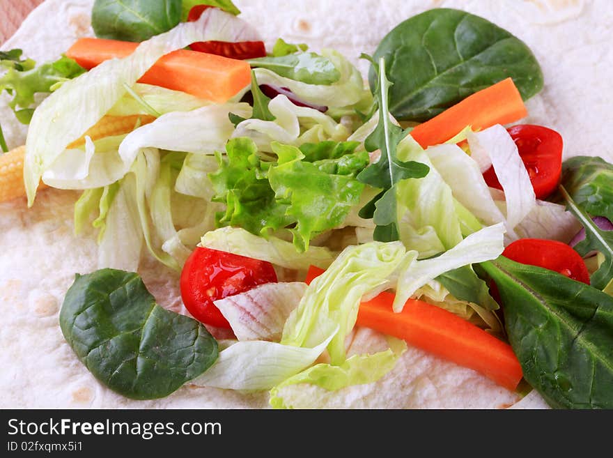 Fresh vegetable salad on tortilla