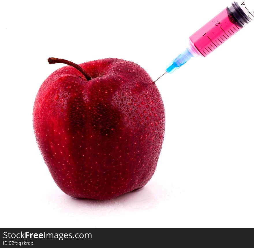 Red Apple With Syringe Injecting Color on Isolted White Background