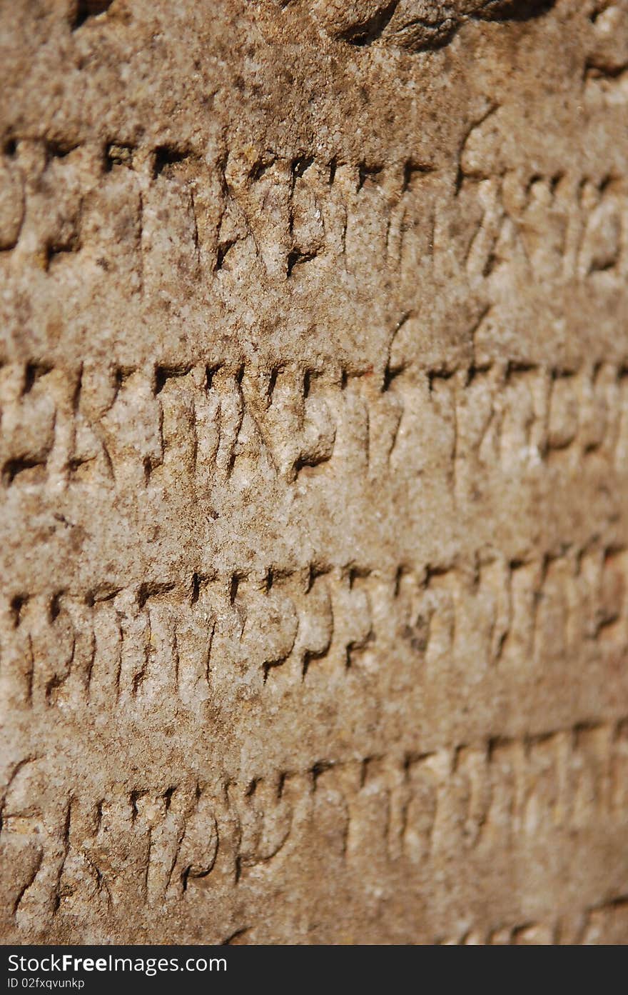 Medieval blurry jewish writing in stone as background