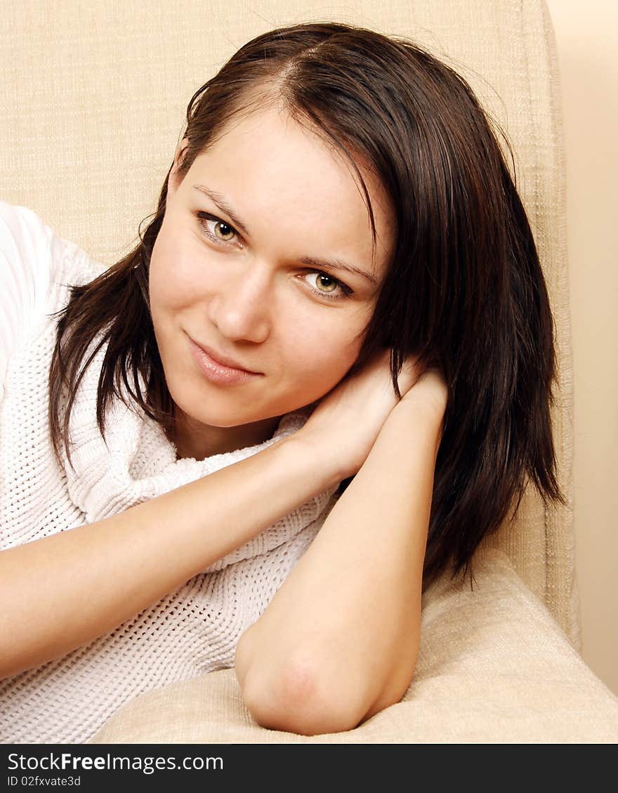 Young beautiful woman relaxing on the sofa