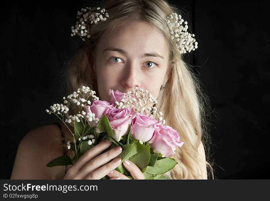 Bride holding the wedding bouquet, studio