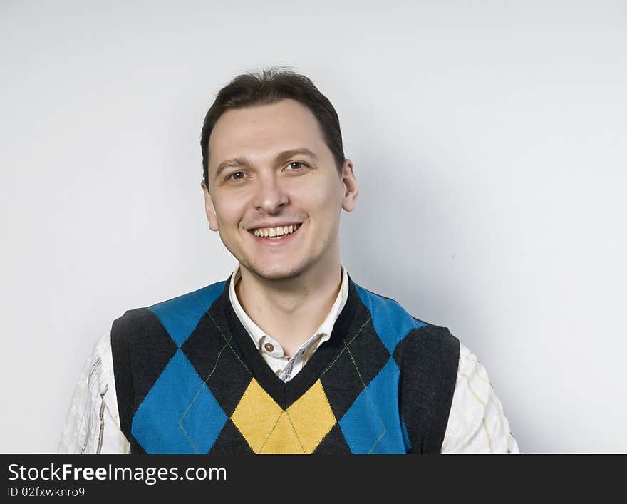 Handsome young man smiling, studio. Handsome young man smiling, studio