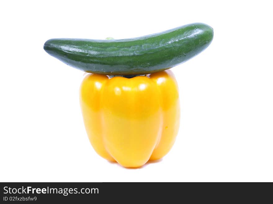 Pepper with cucumber over white background