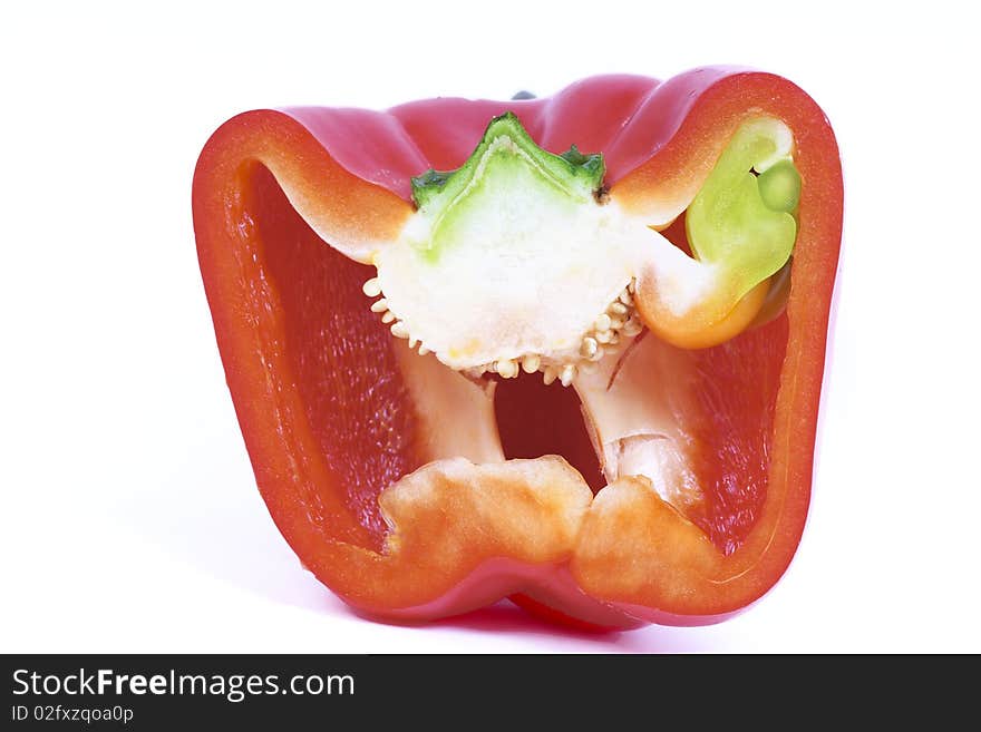 A half red bell pepper on white background