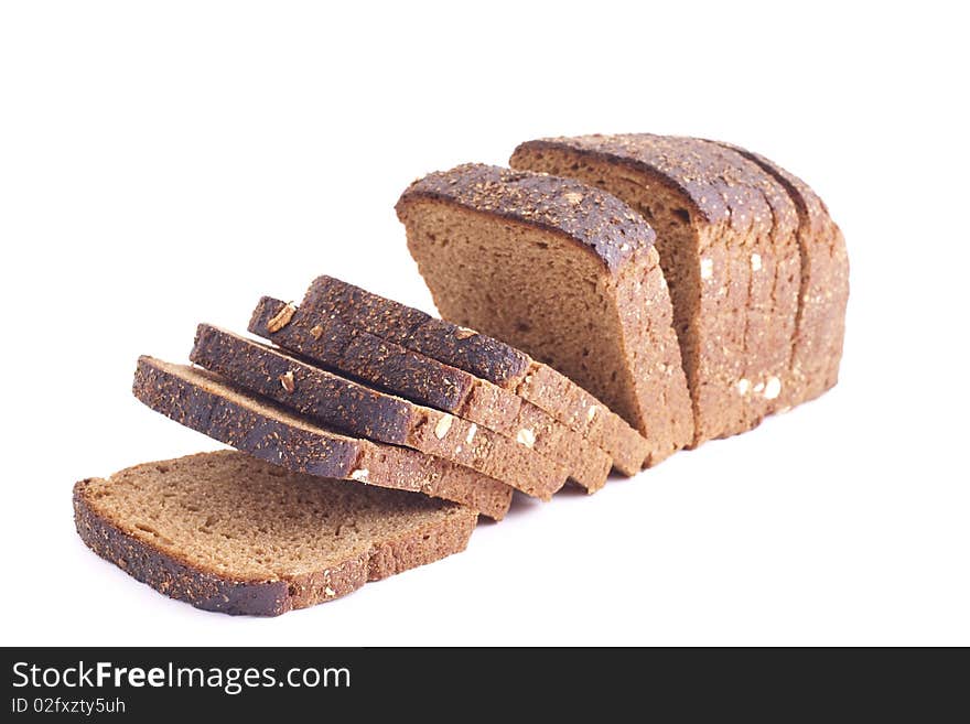 Several slices of whole grain bread over a white background