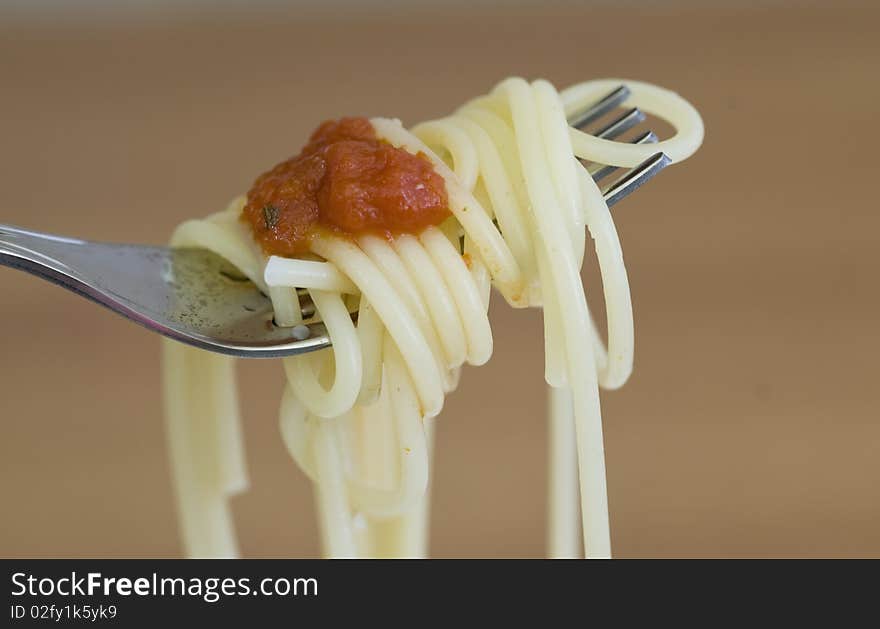 Freshly made spaghetti rolled on fork. Freshly made spaghetti rolled on fork