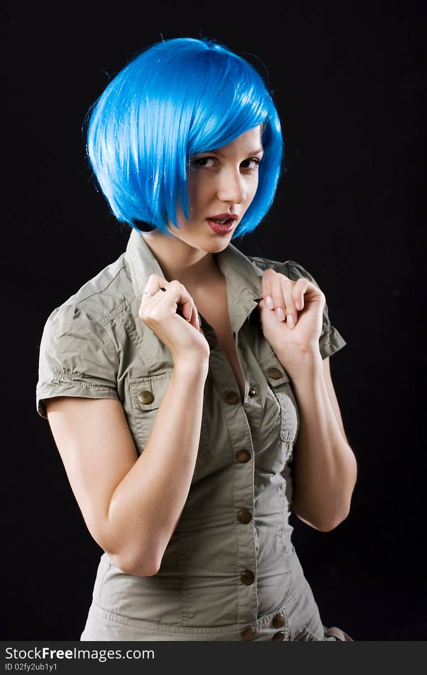 Young beautiful woman in blue artificial wig. Young beautiful woman in blue artificial wig