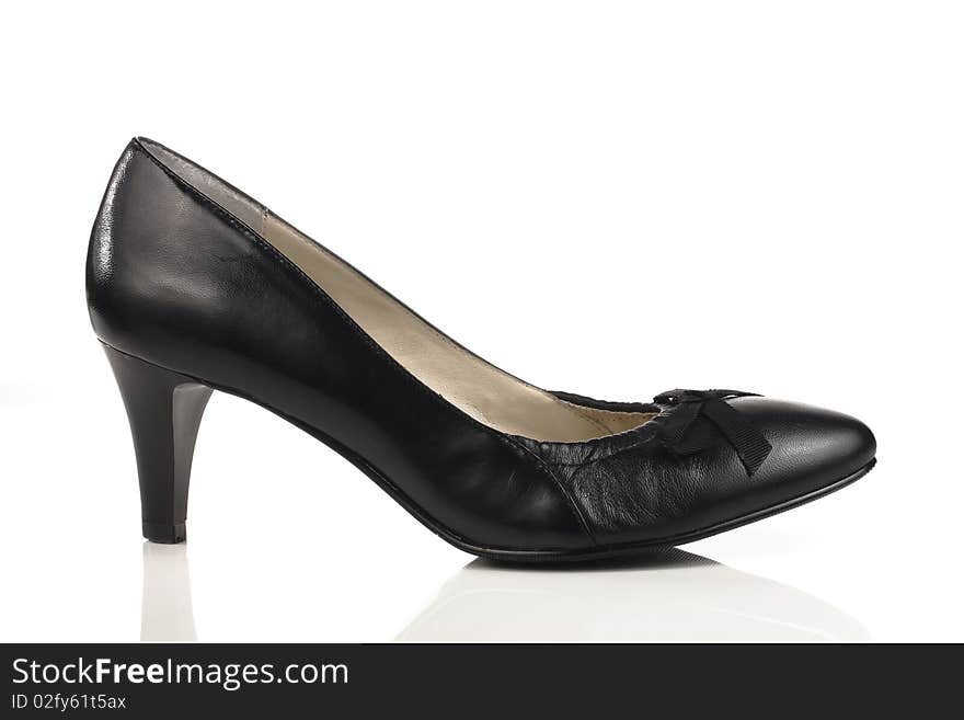 Womens black shoe with a heel on a white background. Womens black shoe with a heel on a white background