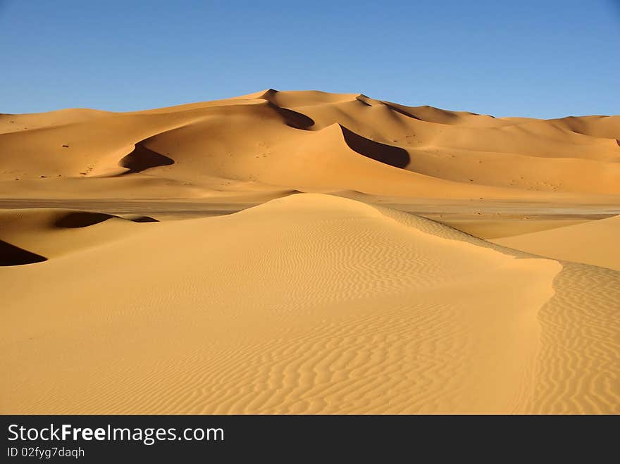 Sand dunes in the desert of Libya, in Africa. Sand dunes in the desert of Libya, in Africa