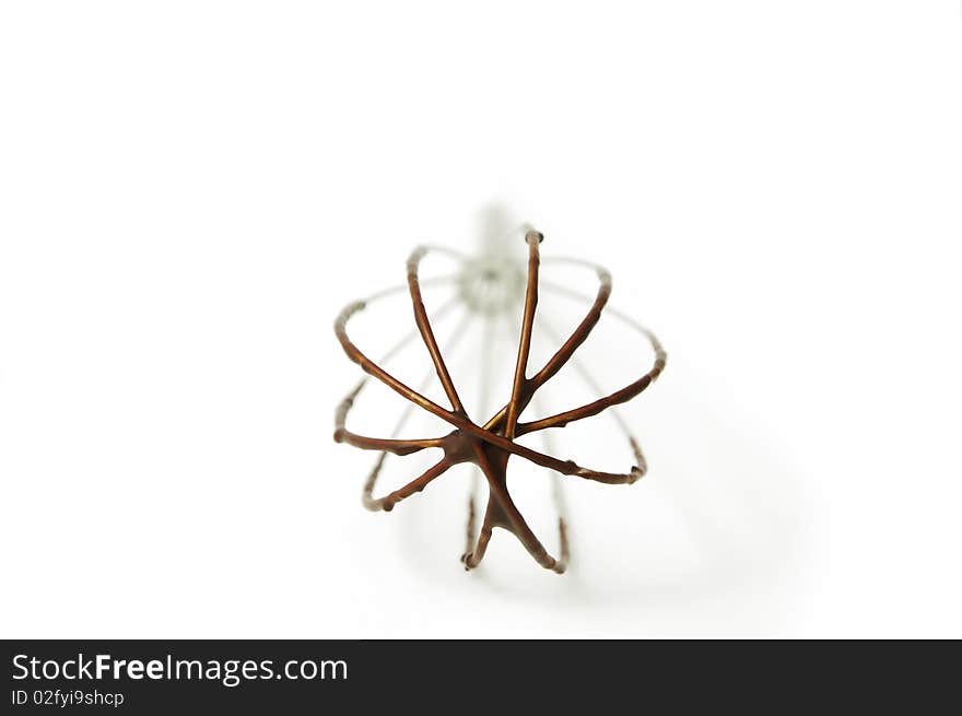 Closeup of kitchen whick in chocolate isolated on white background. Closeup of kitchen whick in chocolate isolated on white background