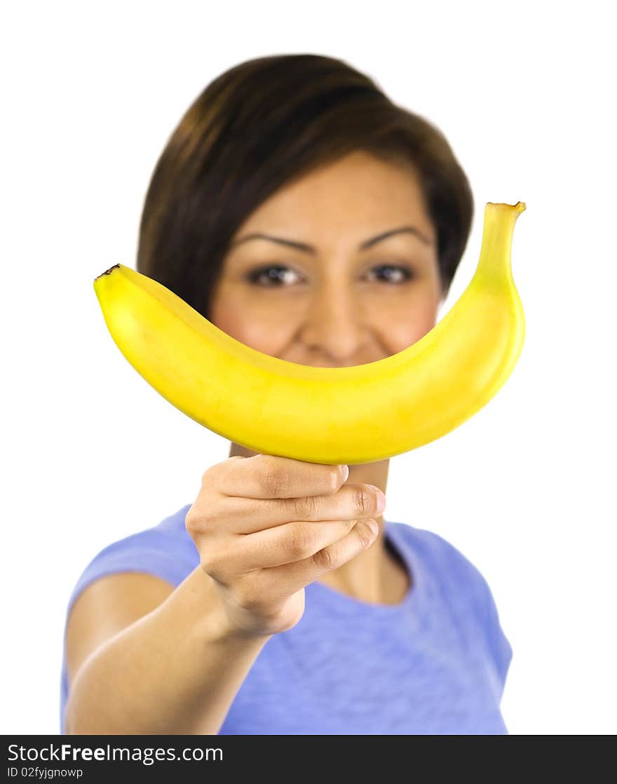 Young woman holds a banana