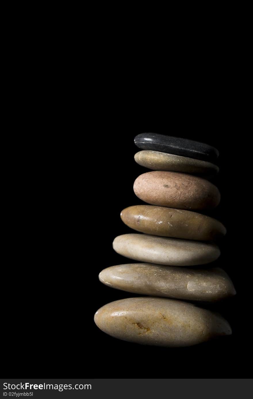 Pebble stack on black background. Pebble stack on black background