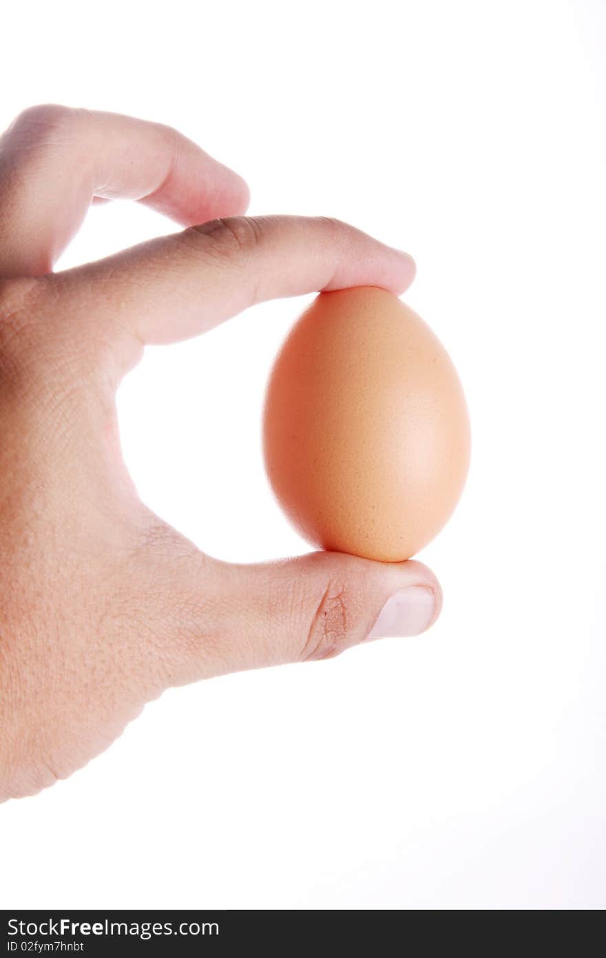 Egg in hand over white background. Food image