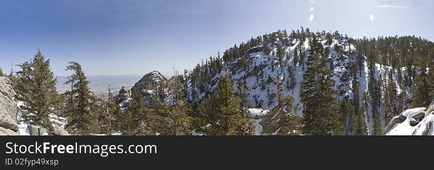 Panoramic view from above palm springs aerial tram of a snow capped mountain. Panoramic view from above palm springs aerial tram of a snow capped mountain