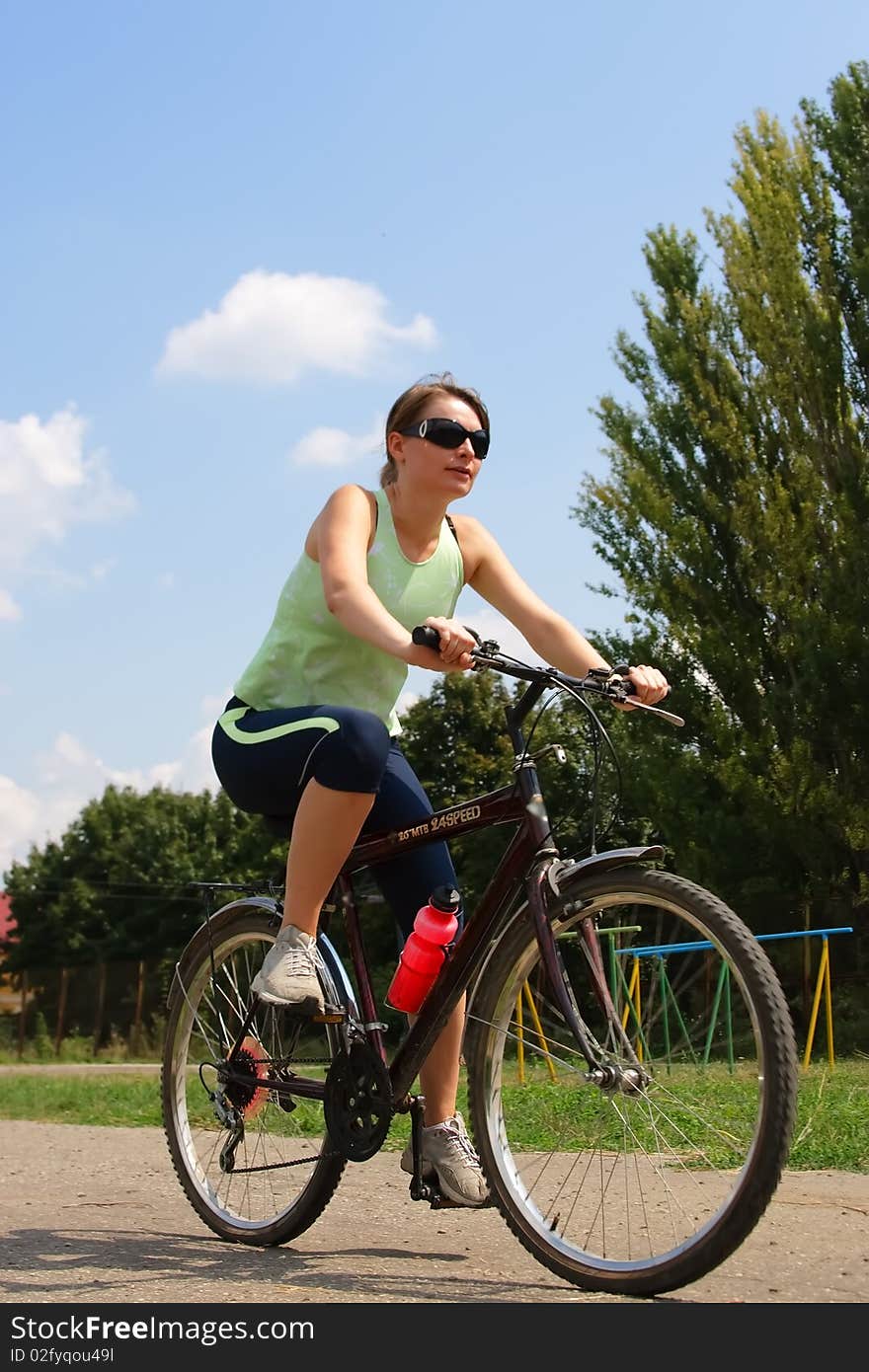 Woman cycling in a park