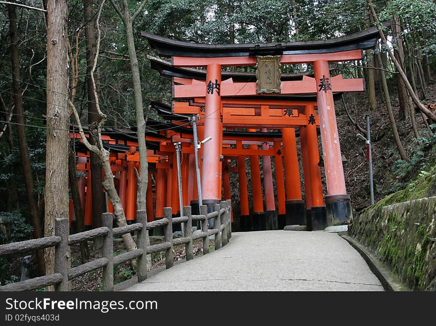 These are Torii gates at Fushimi-inari Shrine, Kyoto, Japan. These gates are found throughout the forest and lead up to the main shrine on the hill top. These are Torii gates at Fushimi-inari Shrine, Kyoto, Japan. These gates are found throughout the forest and lead up to the main shrine on the hill top.