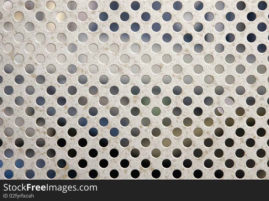 Bright brushed and drilled a hole metal texture background