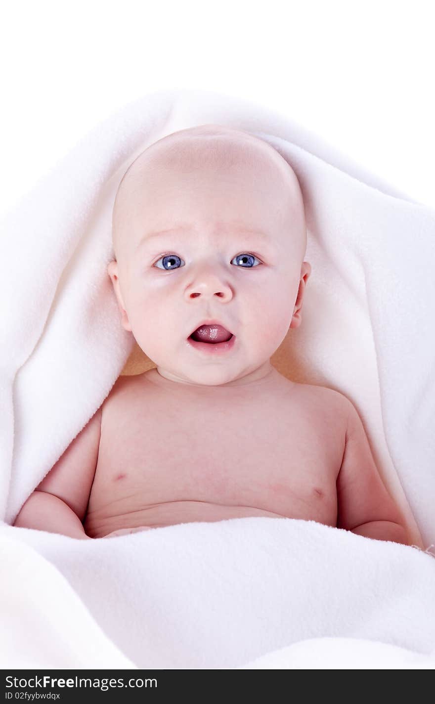 A Beautiful Baby Under A White Towel