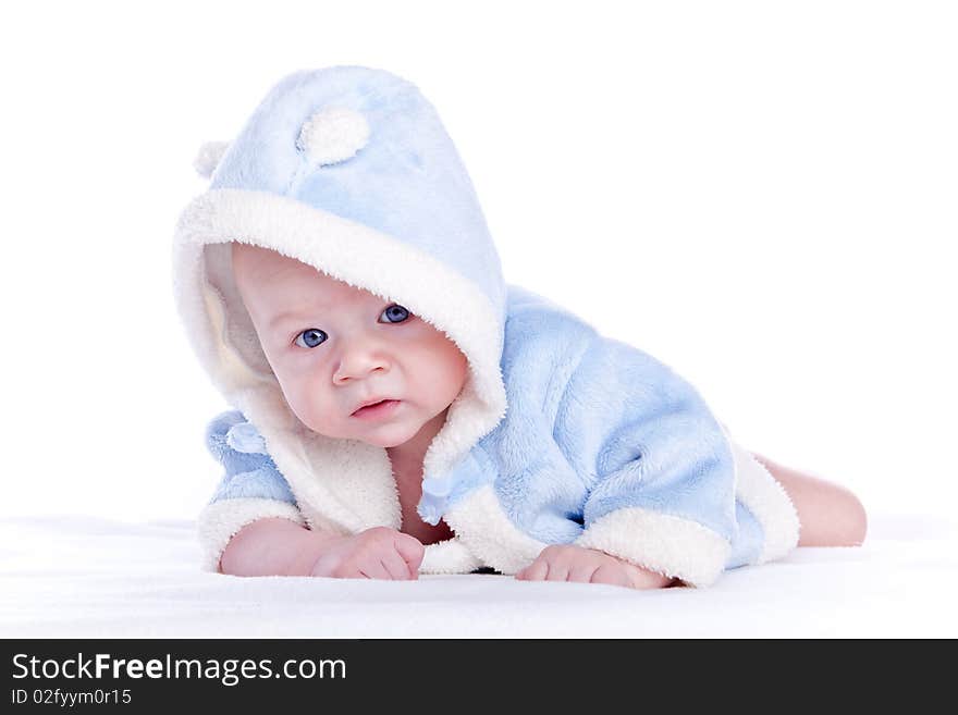 Cute little boy with a warm coat on white background