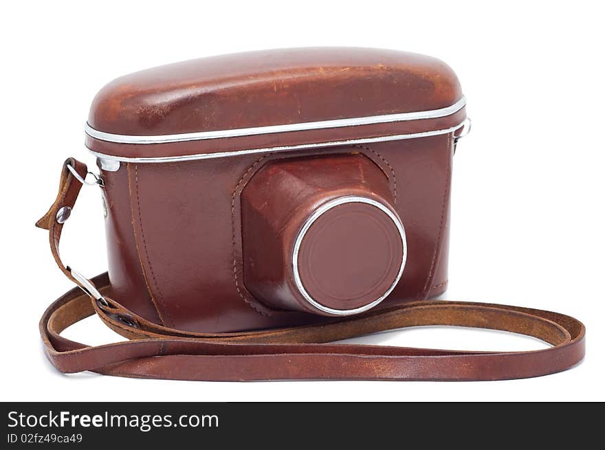 Old camera in a cover isolated on a white background shadow below. Old camera in a cover isolated on a white background shadow below.