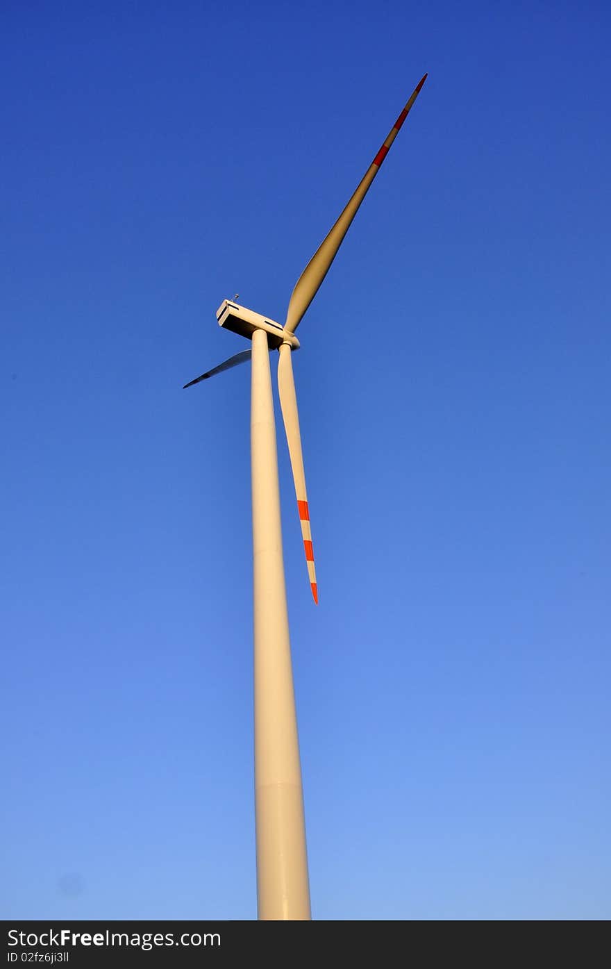 Wind turbine on the clear sky