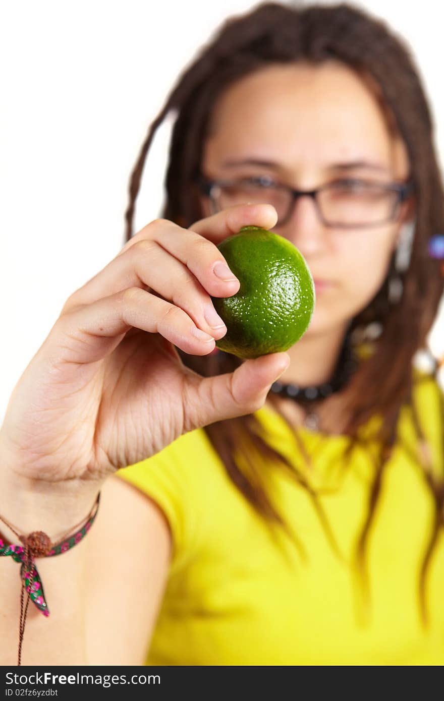 Girl with dreadlocks carring fresh little lime. Girl with dreadlocks carring fresh little lime