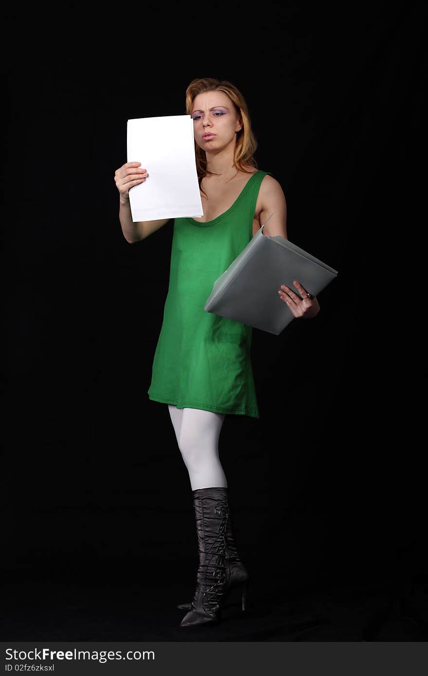 The girl with a folder on a black background