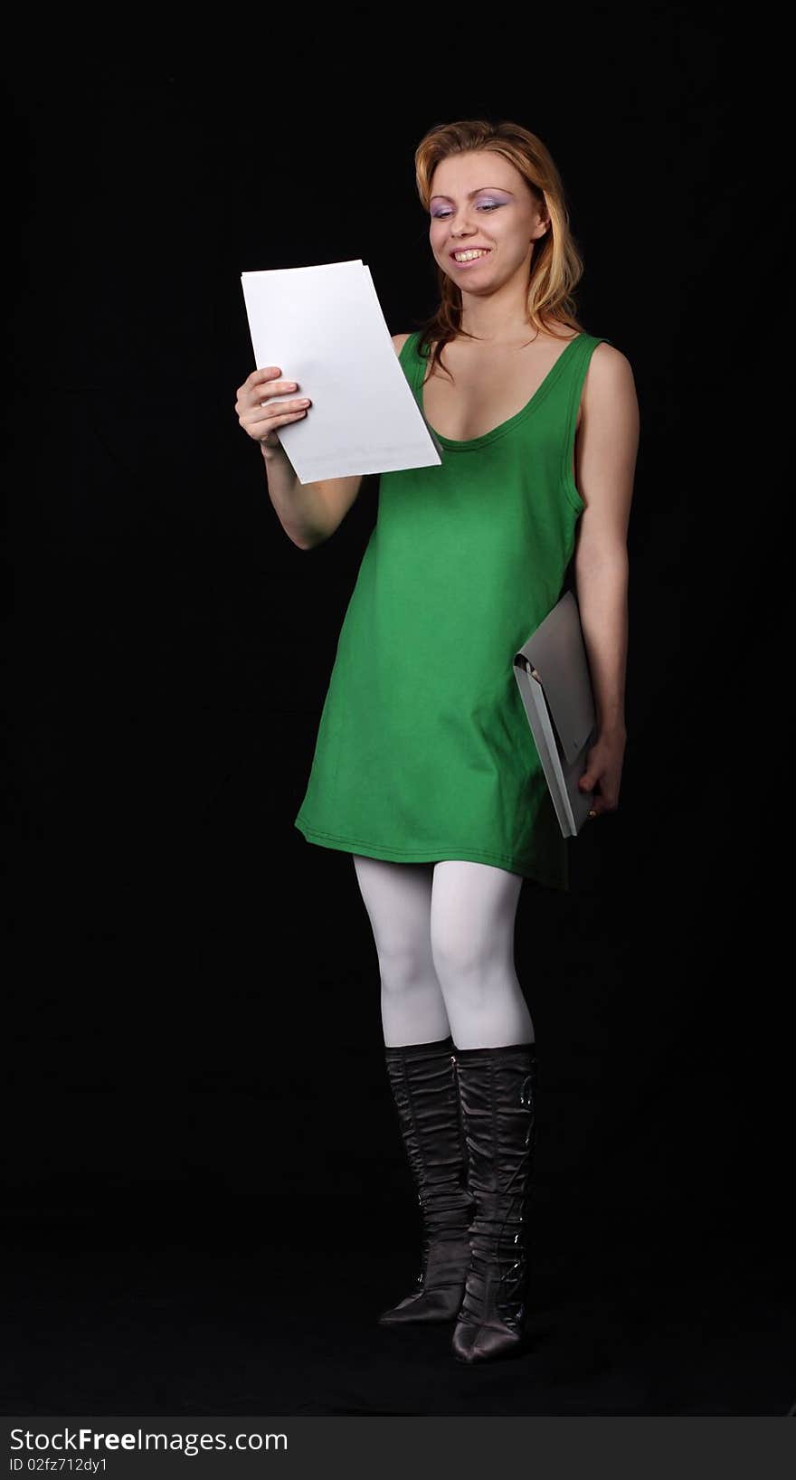 The girl with a folder on a black background