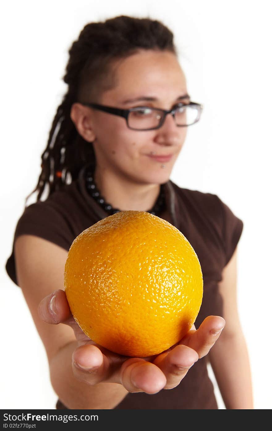 Girl with dreadlocks give an orange, isolated. Girl with dreadlocks give an orange, isolated