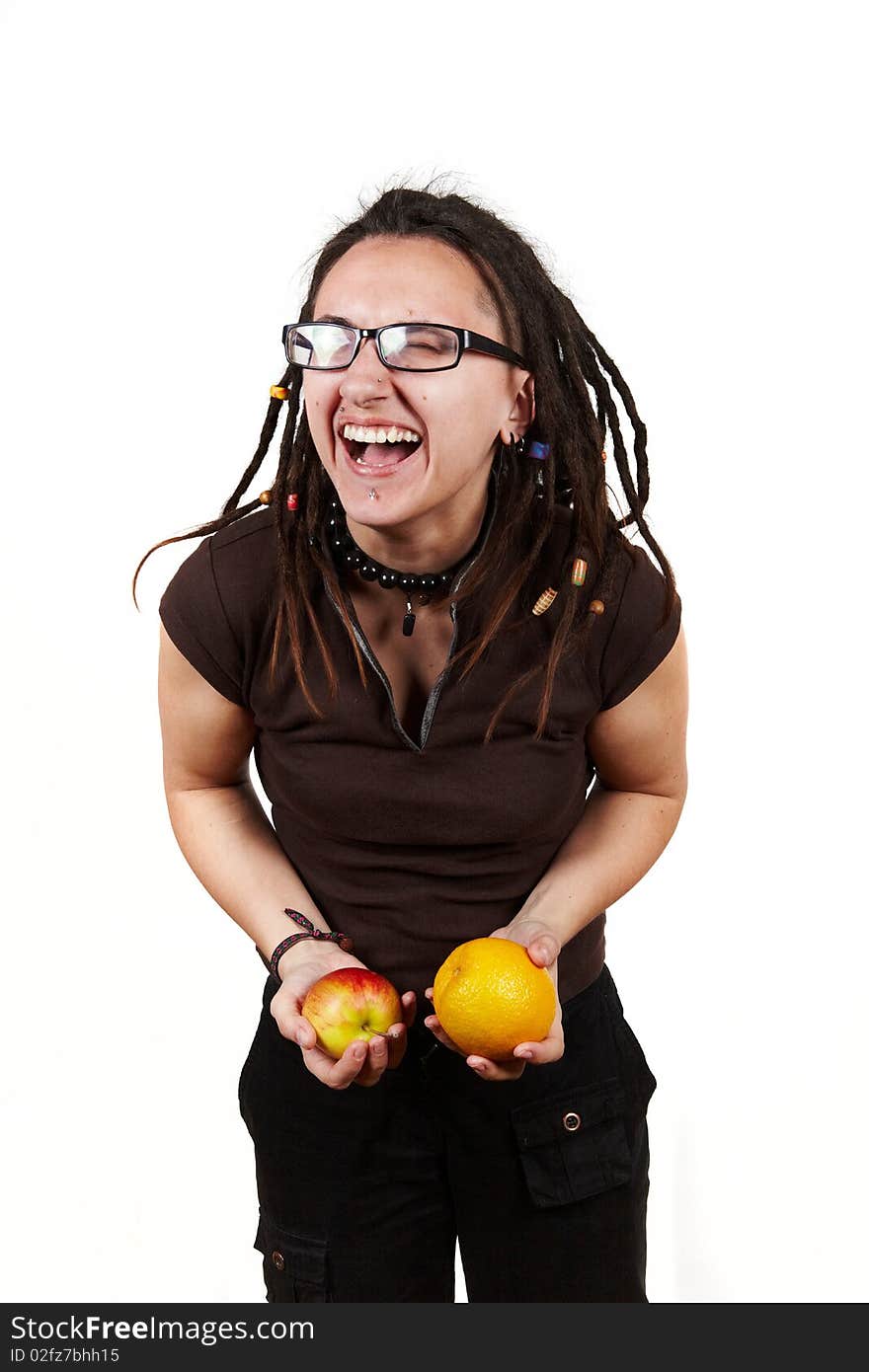 Girl with dreadlocks laught with apple and orange. Girl with dreadlocks laught with apple and orange