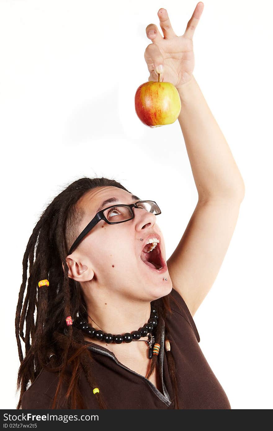 Girl with dreadlocks trying to eat fresh apple. Girl with dreadlocks trying to eat fresh apple