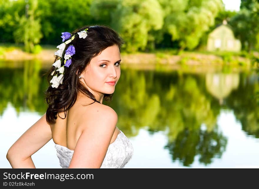 Portrait of young beautiful woman near lake. Portrait of young beautiful woman near lake