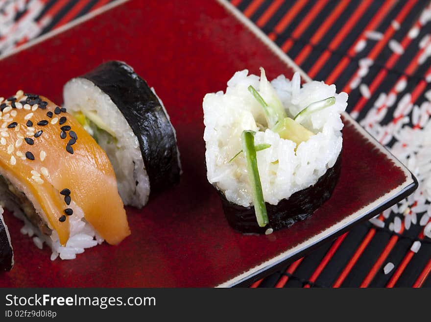 A complete sushi meal with chopsticks on tatami mat