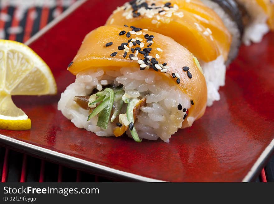 A complete sushi meal with chopsticks on tatami mat