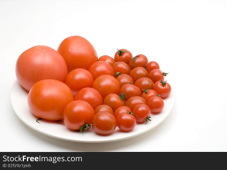 From small to big Tomato on the plate. From small to big Tomato on the plate