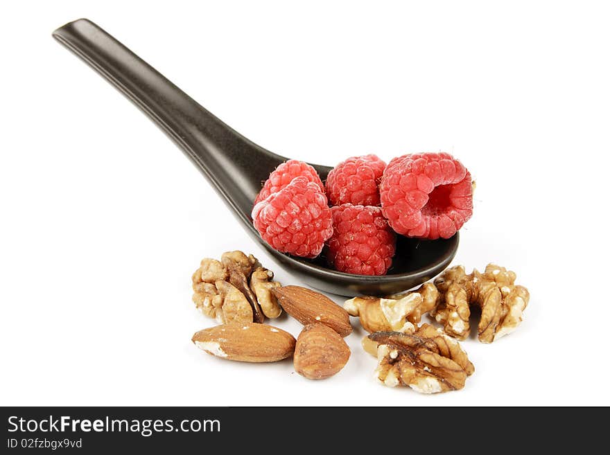 Frozen Raspberries on a Spoon with Nuts