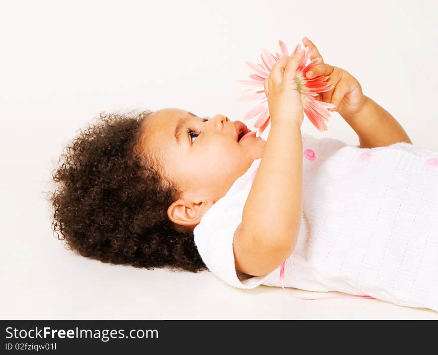 Portrait of a tender little girl with a flower