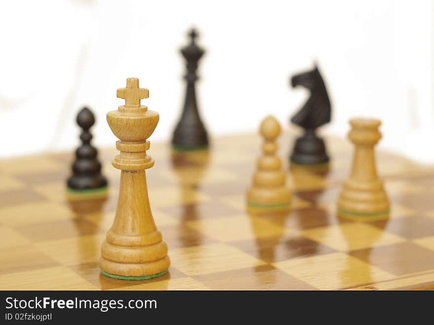 Chess figures while playing (white background). Chess figures while playing (white background)