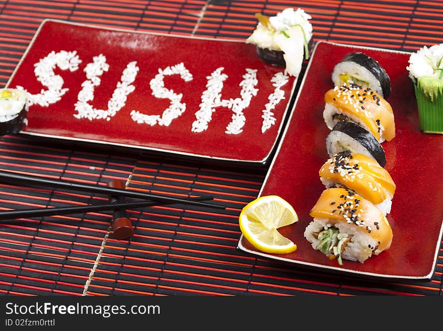 A complete sushi meal with chopsticks on tatami mat