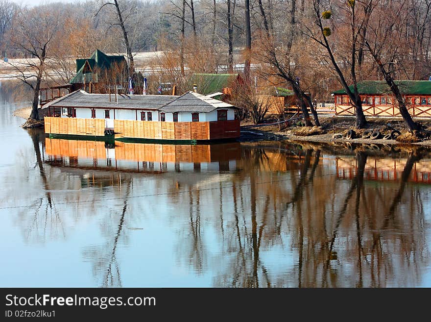 Small building and it reflection on the Dniper river in Kiev