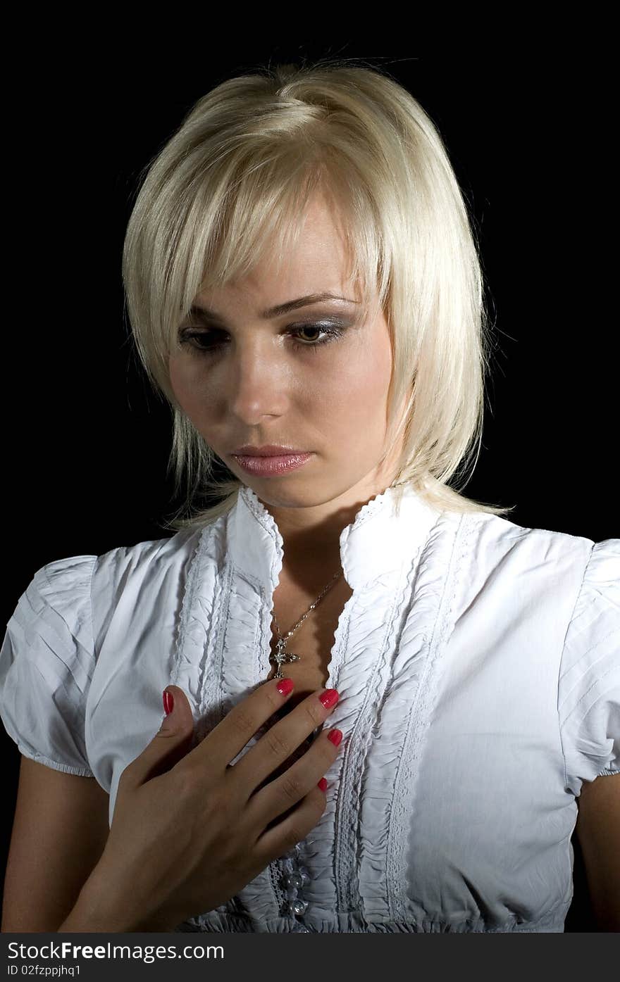 Beautiful, sad woman, portrait on a black background