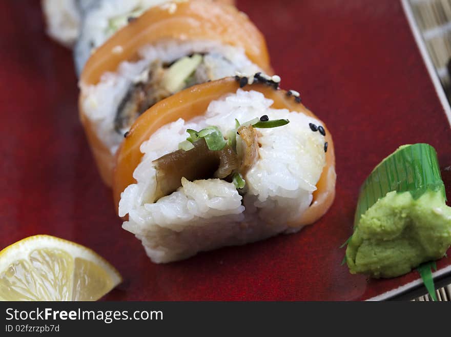 A complete sushi meal with chopsticks on tatami mat