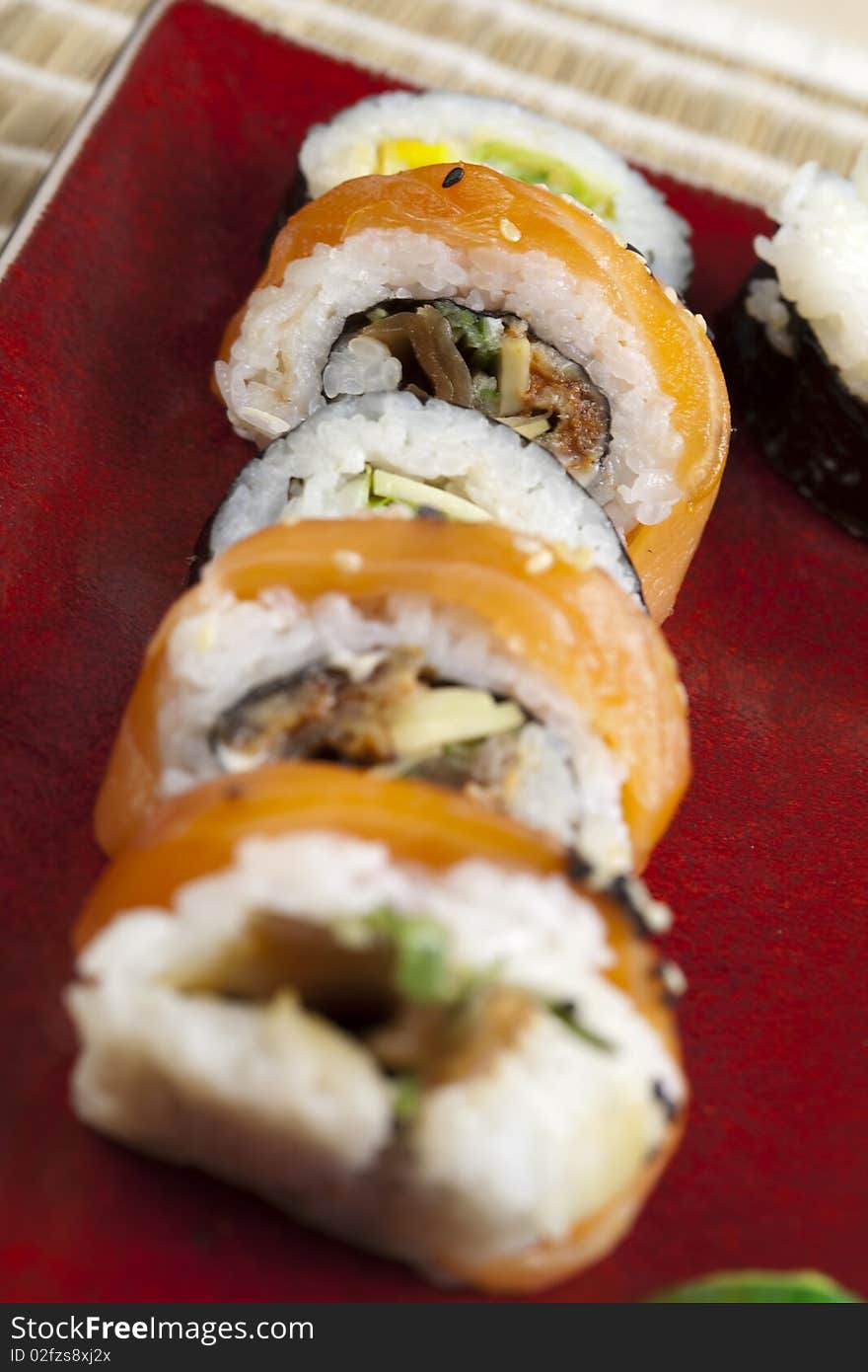 A complete sushi meal with chopsticks on tatami mat