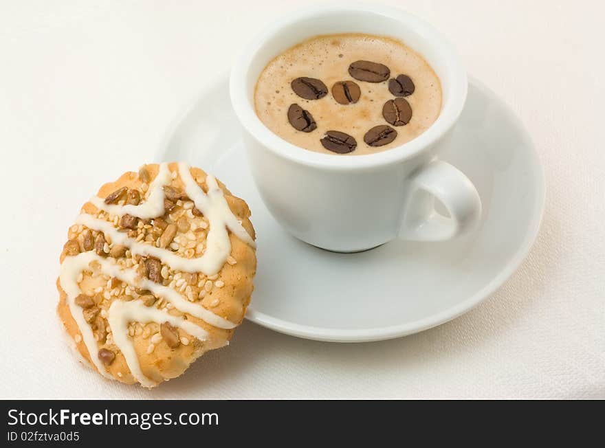 Cup of cappuccino and cookies