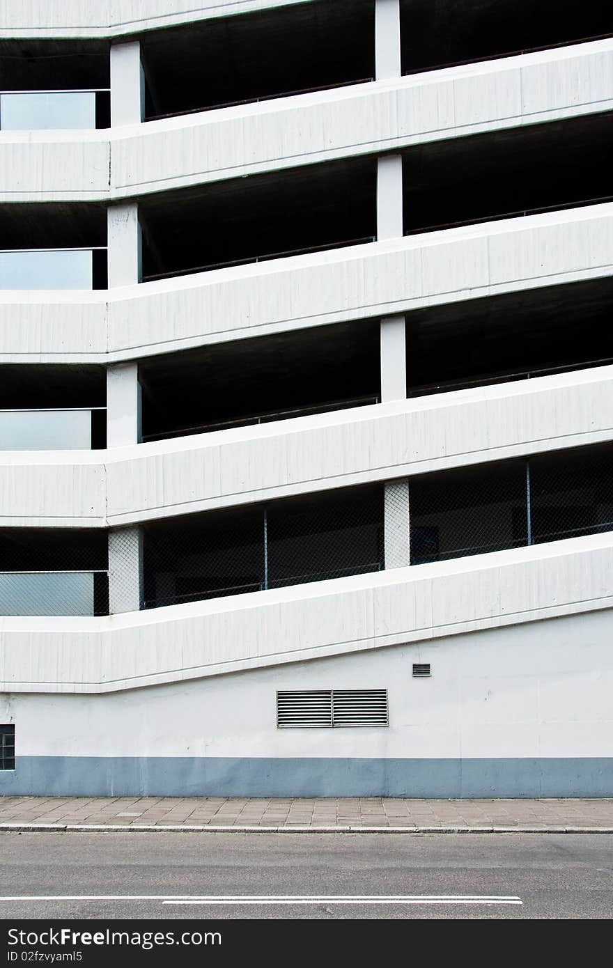 A multivlevel parking building in white concrete