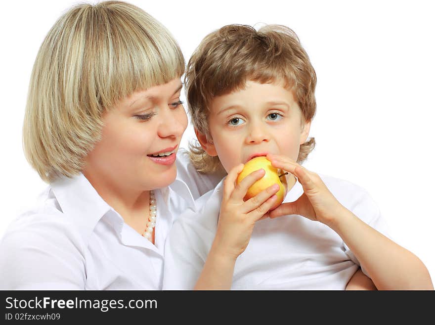 Woman and little boy playing and eating an apple. Woman and little boy playing and eating an apple