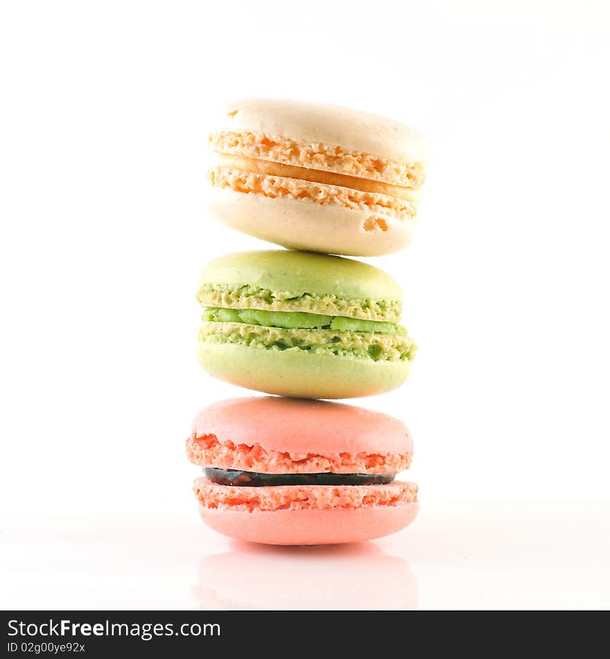 3 macaroons composition on a white background